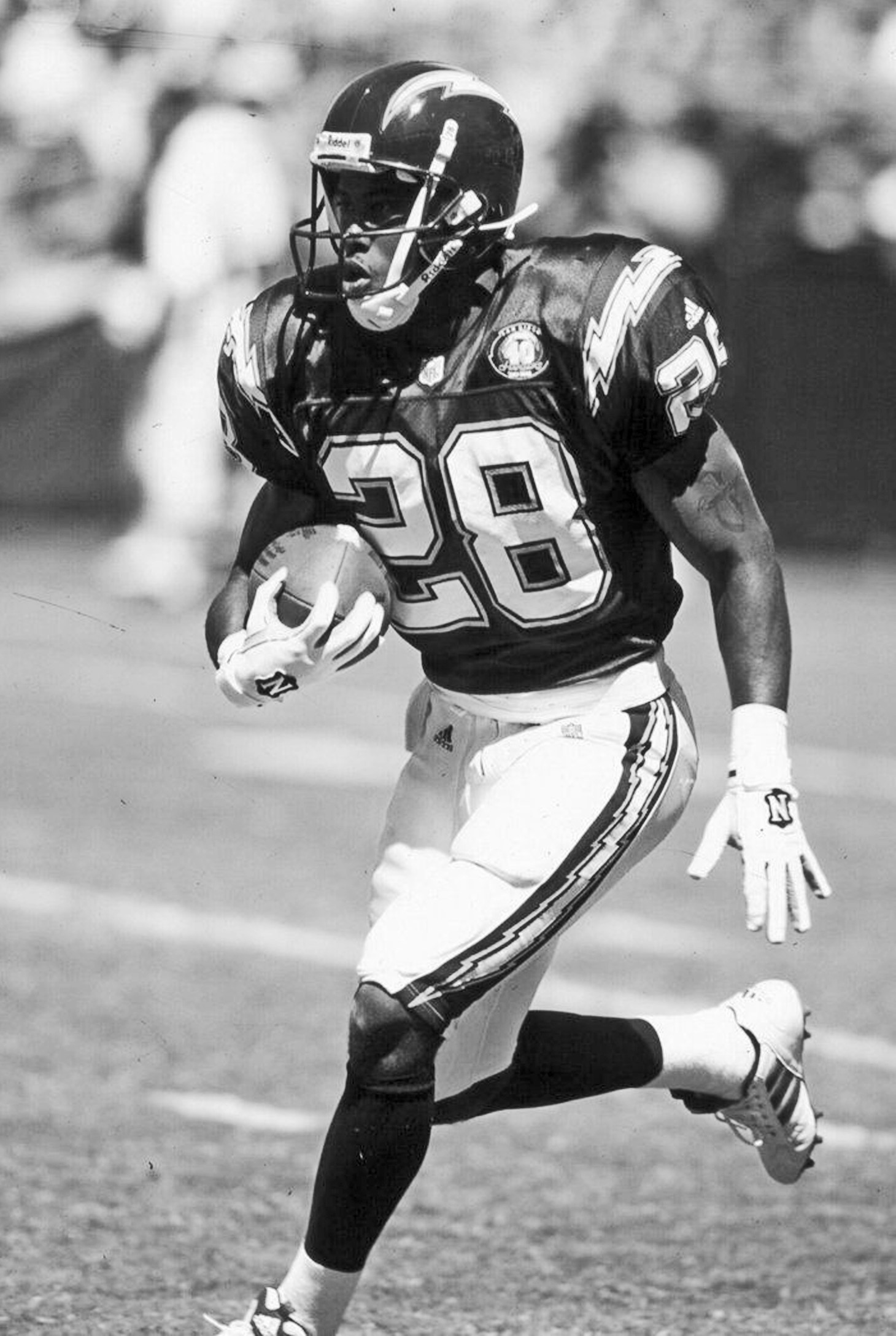 Founder Ronney Jenkins running with the football in his San Diego Chargers #28 jersey